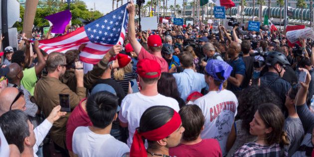 San Diego, California, USA - May 27, 2016: Tensions rise as anti-Trump protesters meet Trump supporters and American and Mexican flags are held up representing each group at a Donald Trump rally at the San Diego Convention Center.