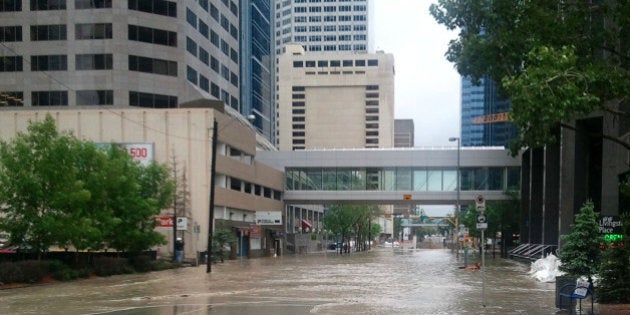 Rising water floods the Bow River in downtown Calgary on June 21, 2013. As many as 100,000 people have been forced from their homes, but Mayor Naheed Nenshi warned Friday the worst is yet to come in what is expected to be Calgary, Alberta's most devastating flood in decades. Flooding forced the evacuation on Friday of some 100,000 people in Calgary and nearby towns in the heart of the Canadian oil patch. Schools were closed and the military sent in two helicopters and hundreds of troops to help clear as many as 24 neighborhoods as heavy rains caused the Bow and Elbow Rivers in western Canada to overflow their banks. AFP PHOTO / ADAM KLAMAR (Photo credit should read ADAM KLAMAR/AFP/Getty Images)