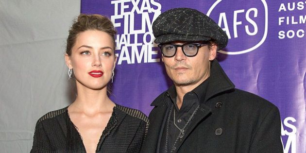AUSTIN, TX - MARCH 06: Actors Amber Heard and Johnny Depp arrive at The Texas Film Hall Of Fame Awards presented by the Austin Film Society at Austin Studios on March 6, 2014 in Austin, Texas. (Photo by Rick Kern/WireImage)