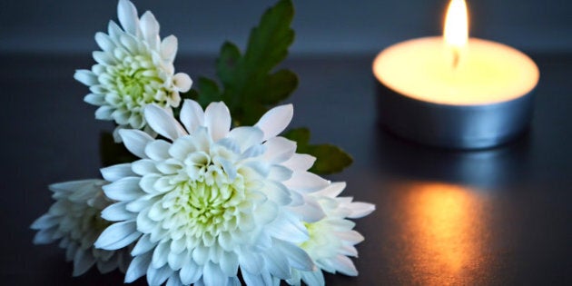 Candle and white flowers