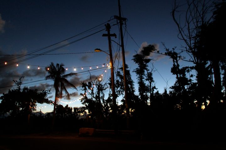 Lights powered by a generator hang over a street in Vieques on Nov. 26, 2017, two months after Hurricane Maria made landfall in Puerto Rico.