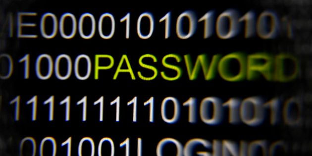 The word 'password' on a computer screen is magnified with a magnifying glass in this picture illustration taken in Berlin May 21, 2013. The Financial Times' website and Twitter feeds were hacked May 17, 2013, renewing questions about whether the popular social media service has done enough to tighten security as cyber-attacks on the news media intensify. The attack is the latest in which hackers commandeered the Twitter account of a prominent news organization to push their agenda. Twitter's 200 million users worldwide send out more than 400 million tweets a day, making it a potent distributor of news. REUTERS/Pawel Kopczynski (GERMANY - Tags: CRIME LAW SCIENCE TECHNOLOGY)