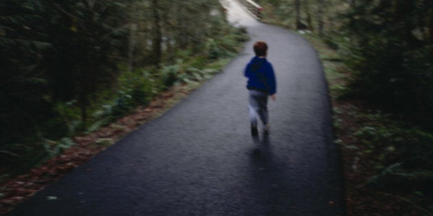 Boy Running Down Rural Road