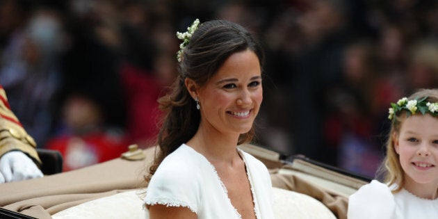 Maid of honour Philippa Middleton and Margarita Armstrong-Jones (R) smile as they travel in a Semi-State Landau in London after the wedding service for Britain's Prince William and Kate, Duchess of Cambridge, on April 29, 2011. AFP PHOTO / PAUL ELLIS (Photo credit should read PAUL ELLIS/AFP/Getty Images)