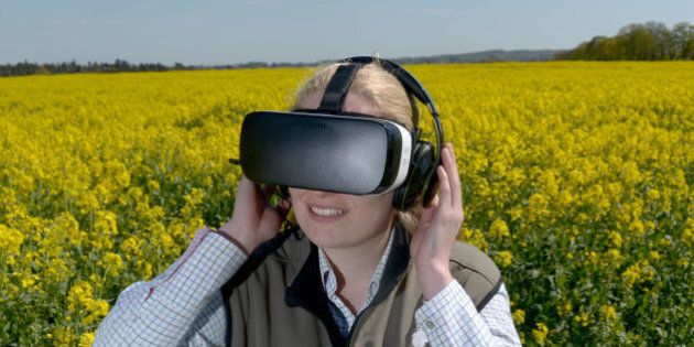 McDonald's Progressive Young Farmer Alice Partridge, 21, wears an Oculus Virtual Reality headset in rape seed field during McDonald's Follow Our Foodsteps campaign launch at Shiplake Farm, Henley-on-Thames.
