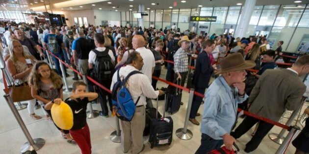 MISSISSAUGA, ON - JULY 28: The marshalling area in front of security screening is full of passengers headed to departure gates. The GTAA is warning passengers at Pearson International Airport the line ups to pass security could get longer this summer as 18% more passengers are expected. The line up to enter security at Terminal 1, took about 30 minutes to pass. (Rick Madonik/Toronto Star via Getty Images)