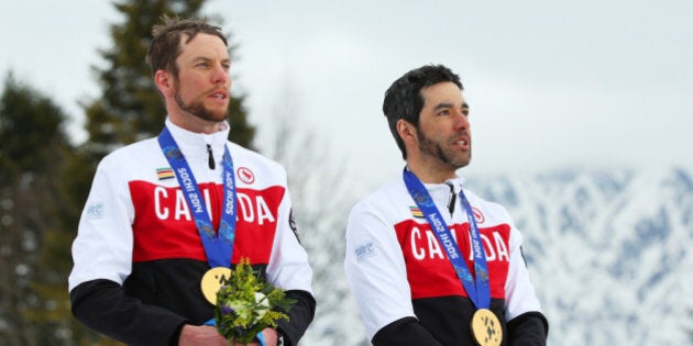 SOCHI, RUSSIA - MARCH 16: Gold medalist Brian McKeever (R) of Canada and guide Erik Carleton pose during the medal ceremony for the Mens Cross Country 10km Free Visually Impaired on day nine of the Sochi 2014 Paralympic Winter Games at Laura Cross-country Ski and Biathlon Center on March 16, 2014 in Sochi, Russia. (Photo by Mark Kolbe/Getty Images)