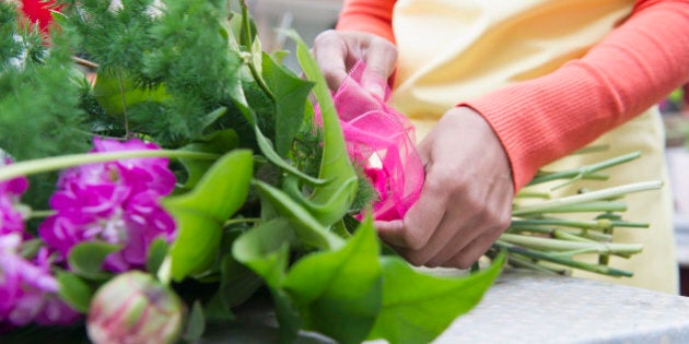 Mixed race woman working in florist shop