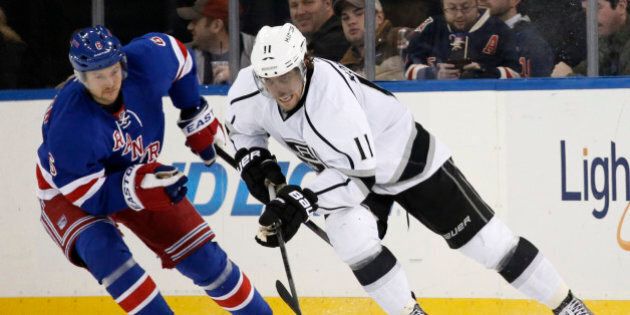 New York Rangers defenseman Anton Stralman (6) of Sweden pursues Los Angeles Kings center Anze Kopitar (11) in the second period of their NHL hockey game at Madison Square Garden in New York, Sunday, Nov. 17, 2013. (AP Photo/Kathy Willens)