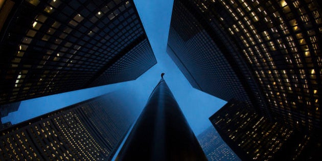 Buildings are seen in the financial district in Toronto, January 28, 2013. Moody's Investors Service has cut the ratings of six Canadian financial institutions, including the previously