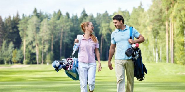 young couple on the golf course