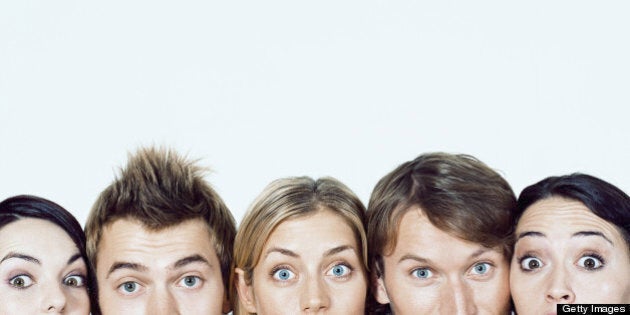 Five young adults in row, portrait, high section
