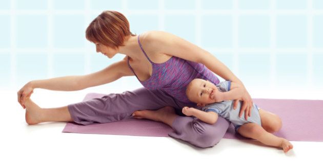 Yoga for woman and child / Mother with her baby boy doing yoga exercise