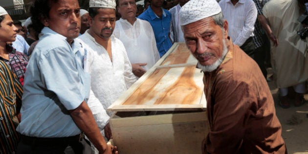 Bangladeshi Muslims carry the body of Xulhaz Mannan who was stabbed to death by unidentified assailants for his funeral in Dhaka, Bangladesh, Tuesday, April 26, 2016. The banned group Ansar-al Islam, the Bangladeshi branch of al-Qaida on the Indian subcontinent, has claimed responsibility for the killings of gay rights activist Mannan and his friend in the capital, Dhaka. (AP Photo)