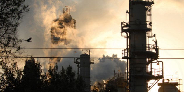 UNITED STATES - SEPTEMBER 18: An Exxon Mobil refinery in silhouetted against the sky at dusk in Torrance, California, U.S., on Tuesday, September 18, 2007. California, the most-populous U.S. state, emitted the equivalent of 436.1 million metric tons of carbon dioxide in 1990, according to a draft estimate of global warming pollution from the state's air-quality regulator. Heads of state and other top officials from more than 150 countries will attend the largest meeting ever of world leaders on climate change at the United Nations on September 24, 2007, in New York. (Photo by Jamie Rector/Bloomberg via Getty Images)