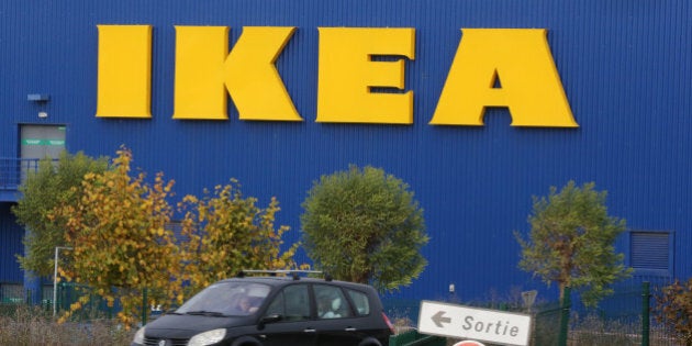 A car is driven past the IKEA store in Plaisir, west of Paris, Wednesday Nov. 20, 2013. Officials say senior executives of IKEA France are in police custody, over allegations that they illegally spied on employees and customers.(AP Photo/Remy de la Mauviniere)