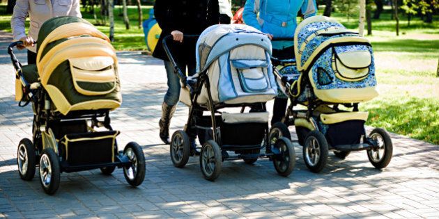 three baby carriage in park