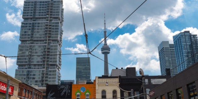 TORONTO, ONTARIO, CANADA - 2016/08/18: CN Tower seen from double decker bus with tourists enjoying a guided tour for sightseeing Toronto city. (Photo by Roberto Machado Noa/LightRocket via Getty Images)