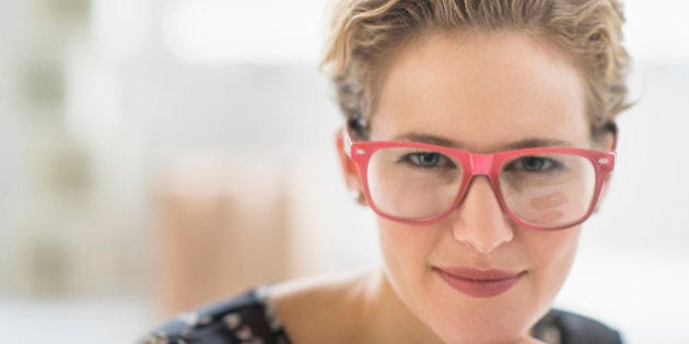 USA, New Jersey, Portrait of young woman wearing glasses