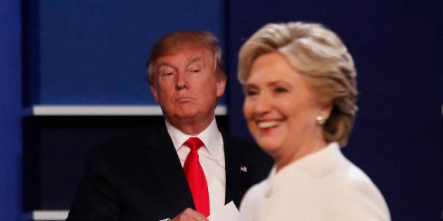 Republican U.S. presidential nominee Donald Trump and Democratic U.S. presidential nominee Hillary Clinton finish their third and final 2016 presidential campaign debate at UNLV in Las Vegas, Nevada, U.S., October 19, 2016. REUTERS/Mike Blake