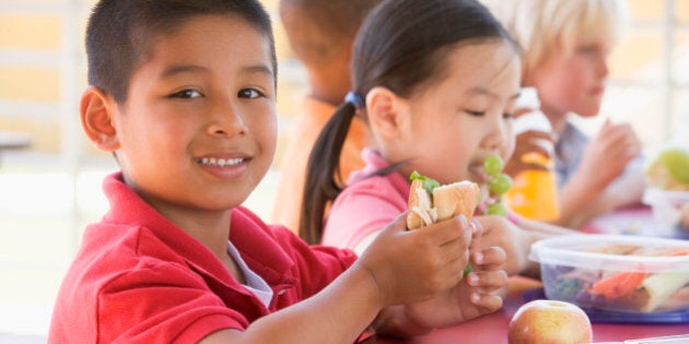 Kindergarten children eating lunch