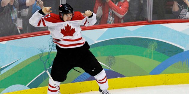 FILE - In this Feb. 28, 2010, file photo, Canada's Sidney Crosby (87) leaps in the air after making the winning goal in the overtime period of a men's gold medal ice hockey game against USA at the Vancouver 2010 Olympics in Vancouver, British Columbia. With the Olympics less than a year off and both sides talking tough, chances that NHL players won't compete in the Winter Games are only slightly better than a snowball in well, Sochi. (AP Photo/Chris O'Meara, File)