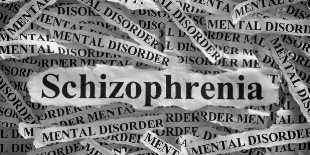 Schizophrenia. Torn pieces of paper with the word Schizophrenia and mental disorder. Concept Image. Black and White. Closeup.
