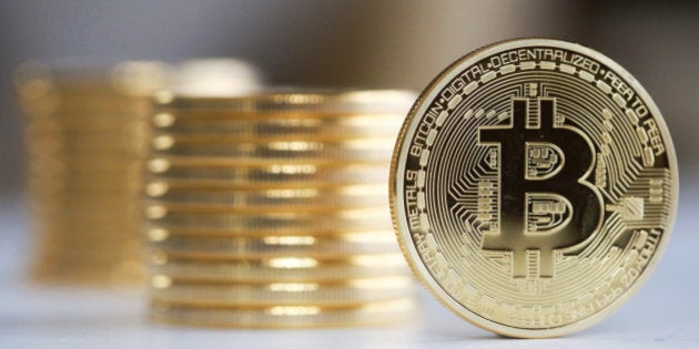 A single Bitcoin stands in front of a collection of Bitcoins in this arranged photograph in Danbury, U.K., on Thursday, Dec. 10, 2015. Bitcoin, the digital currency, climbed on Wednesday to hit its highest levels since early November, amid fresh speculation that the identity of Satoshi Nakamoto -- the virtual currency's creator -- may have finally been revealed. Photographer: Chris Ratcliffe/Bloomberg via Getty Images