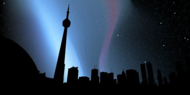 Skyline silhouette of downtown Toronto, Canada, at night.