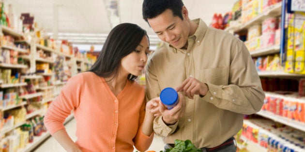 Asian couple grocery shopping