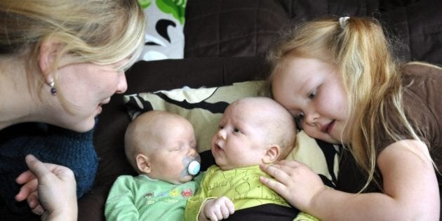 A mother looks at her children in Helsinki, on December 17, 2010. AFP PHOTO / LEHTIKUVA/ SARI GUSTAFSSON *** FINLAND OUT *** (Photo credit should read SARI GUSTAFSSON/AFP/Getty Images)