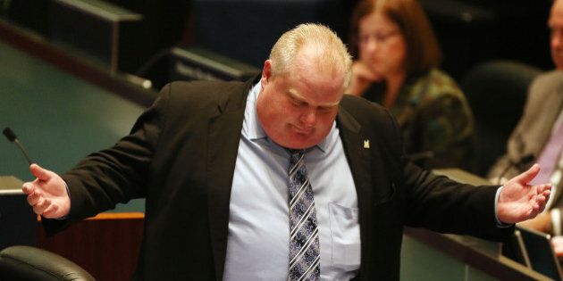 TORONTO, ON- NOVEMBER 13 - Toronto Mayor Rob Ford gestures as he has the last word during debate on councillor Denzil Minnan-Wong's motion at City Hall in Toronto. November 13, 2013. (Steve Russell/Toronto Star via Getty Images)