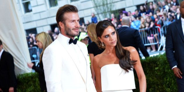 NEW YORK, NY - MAY 05: David Beckham (L) and Victoria Beckham attend the 'Charles James: Beyond Fashion' Costume Institute Gala at the Metropolitan Museum of Art on May 5, 2014 in New York City. (Photo by Mike Coppola/Getty Images)