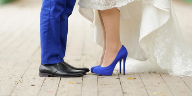 bride and groom standing on...