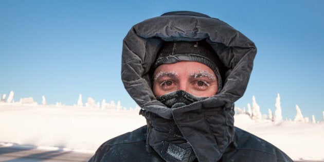 man bundled in winter coat in...