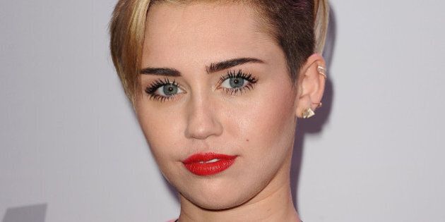Miley Cyrus Debuts New Bob Haircut At Christmas Festival Photos