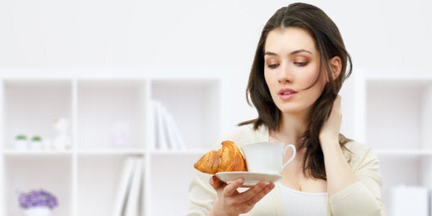 girl looking at her breakfast