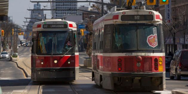 TORONTO, ON - APRIL 2: Lansdowne 512 streetcars pass each other at Wychwood Ave and St. Clair Avenue. TTC stats suggest that the St. Clair right of way for streetcars has improved ridership and cut transit trip times. April 2, 2014. (Chris So/Toronto Star via Getty Images)