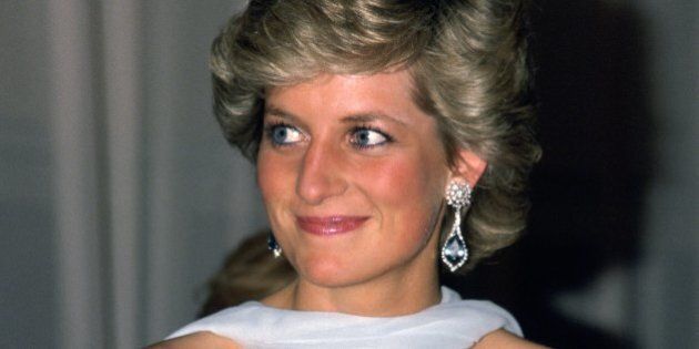 FRANCE - MAY 15: Diana, Princess of Wales attends the Cannes film festival wearing a pale blue chiffon dress and wrap designed by fashion designer Catherine Walker (Photo by Tim Graham/Getty Images)