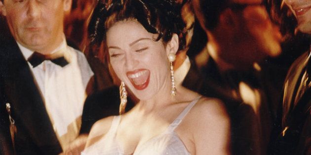 CANNES, FRANCE - 1991: Actress Madonna arrives for the premiere of her film 'In Bed with Madonna' in 1991 at the Cannes Film Festival, France. (Photo by Dave Hogan/Getty Images)