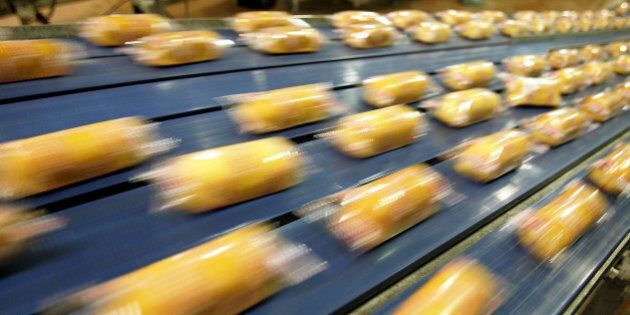 SCHILLER PARK, IL - APRIL 20: Hostess Twinkies move through the packaging process at the Interstate Bakeries Corporation facility April 20, 2005 in Schiller Park, Illinois, a suburb northwest of Chicago. The Twinkie, an American icon and one of the nation's all-time favorite snack cakes, is celebrating its 75th anniversary this month. James A. Dewar created the beloved treat in 1930, while working as a Hostess bakery manager in Chicago. (Photo by Tim Boyle/Getty Images)