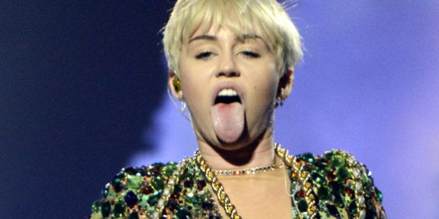 HOUSTON, TX - MARCH 16: Miley Cyrus performs part of her Bangerz Tour at the Toyota Center on March 16, 2014 in Houston, Texas. (Photo by Tim Mosenfelder/WireImage)