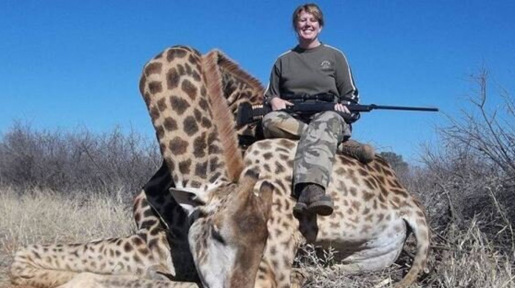 trophy-hunting-woman-shoots-giraffe-poses-triumphantly-with-corpse