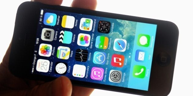 A man displays an Apple's iPhone 5 smartphone on February 25, 2014 in the French northern city of Lille. Apple said on February 24, 2014 it was developing a security fix for its Mac OS X computer operating system after a patch released for its iPhones and iPads to thwart hacker attacks.AFP PHOTO PHILIPPE HUGUEN (Photo credit should read PHILIPPE HUGUEN/AFP/Getty Images)