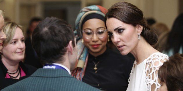 Catherine, the Duchess of Cambridge (R) speaks with guests at a reception hosted by the Governor General Peter Cosgrove and his wife during a reception hosted by the Cosgrove and his wife at Government House in Canberra on April 24, 2014. Britain's Prince William, his wife Kate and their son Prince George are on a three-week tour of New Zealand and Australia. AFP PHOTO / POOL (Photo credit should read Stefan Postles/AFP/Getty Images)