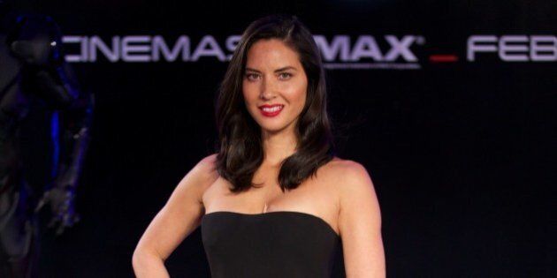 US actress Olivia Munn poses on the red carpet as she arrives for the world pemiere of the film 'Robocop' in central London on February 5, 2014. The superhuman cyborg law enforcer 'RoboCop' returns to the crime-ridden streets of Detroit in this remake of the 1987 science fiction film of the same name. AFP PHOTO / ANDREW COWIE (Photo credit should read ANDREW COWIE/AFP/Getty Images)