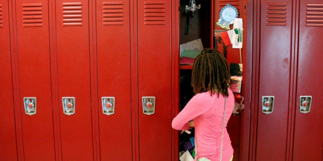 WASHINGTON D.C. June 20: Sixth grader Milan Harris, 11, empties her locker on June 20, 2014, the last day of class at Alice Deal Middle School in Northwest D.C. Harris is nervous about moving upstairs to the seventh grade, because it smells different. Like big kids, kinda stinky, she said. (Jessica Contrera/The Washington Post via Getty Images)