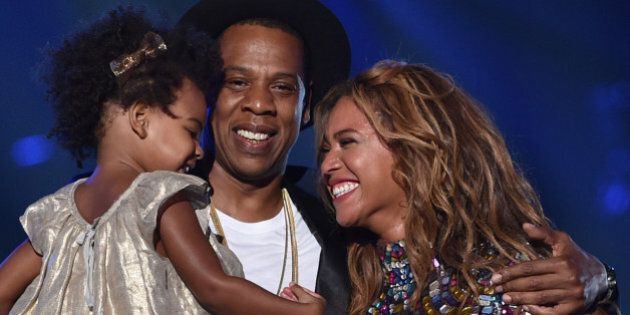 INGLEWOOD, CA - AUGUST 24: (L-R) Blue Ivy Carter, recording artists Jay Z and Beyonce speak onstage during the 2014 MTV Video Music Awards at The Forum on August 24, 2014 in Inglewood, California. (Photo by MTV/MTV1415/Getty Images for MTV)