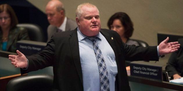 Mayor Rob Ford talks during a City Council debate in Toronto on Wednesday, Nov. 13, 2013. Toronto Mayor Rob Ford admitted Wednesday that he bought illegal drugs in the past two years and that he will not step down. (AP Photo/The Canadian Press, Nathan Denette)