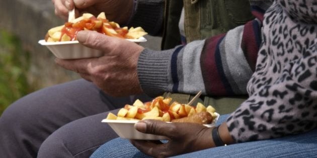 Eating take away chips, UK. (Photo by: Education Images/UIG via Getty Images)